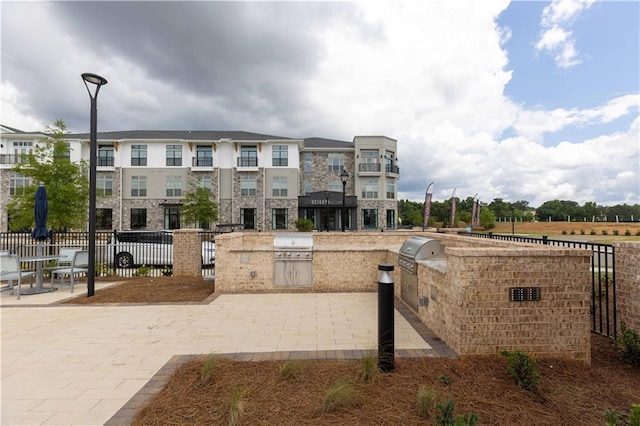 view of community with area for grilling and a patio area