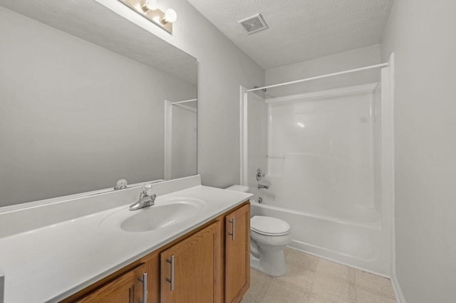 full bathroom with vanity, a textured ceiling, tub / shower combination, and toilet