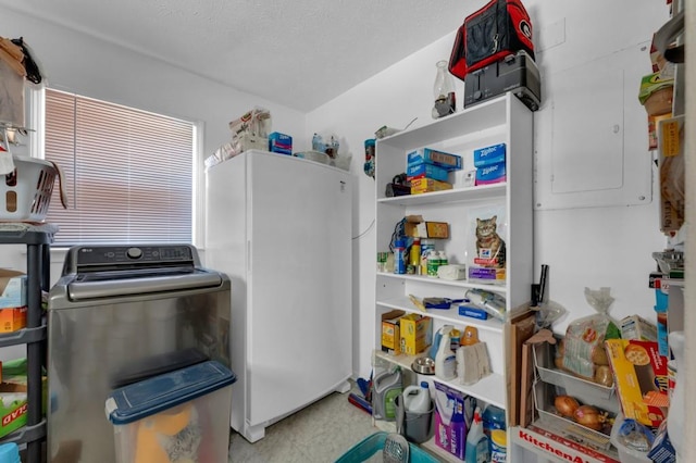 pantry featuring washer / dryer and electric panel