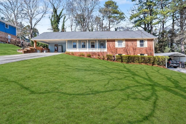 single story home with an attached carport, brick siding, driveway, and a front lawn