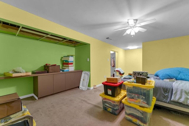 interior space with a ceiling fan, carpet, visible vents, and baseboards