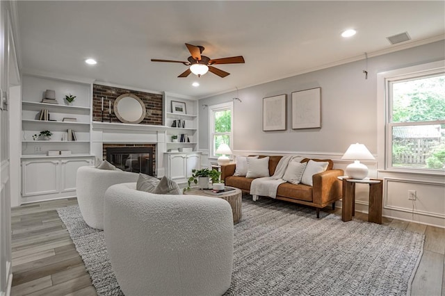 270 Hollyridge Way, Roswell, GA 30076 - living area with a ceiling fan, ornamental molding, light wood-style flooring, a brick fireplace, and built in features
