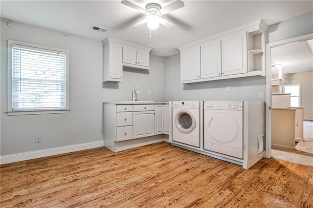 270 Hollyridge Way, Roswell, GA 30076 - laundry area with washing machine and clothes dryer, a ceiling fan, light wood-style floors, and cabinet space