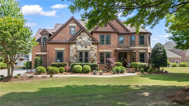 craftsman-style house with a front lawn and brick siding