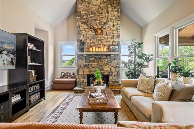 entryway with an inviting chandelier, a decorative wall, stairs, and wood finished floors