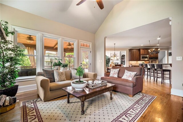 carpeted living room featuring baseboards, visible vents, and ornamental molding