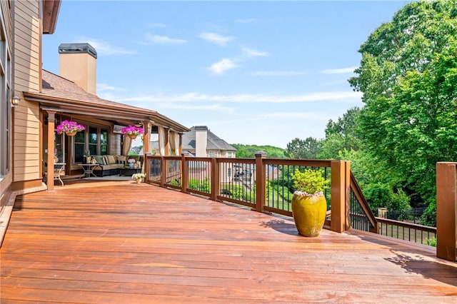 wooden terrace featuring an outdoor hangout area