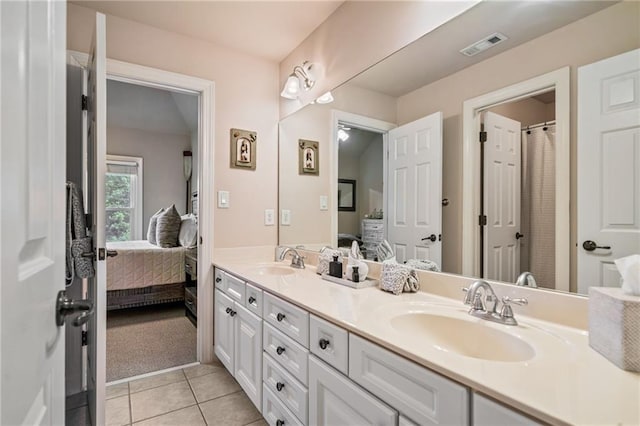 bathroom featuring a sink, visible vents, and connected bathroom