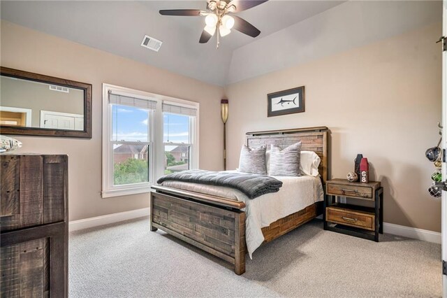 bedroom with baseboards, carpet, and multiple windows