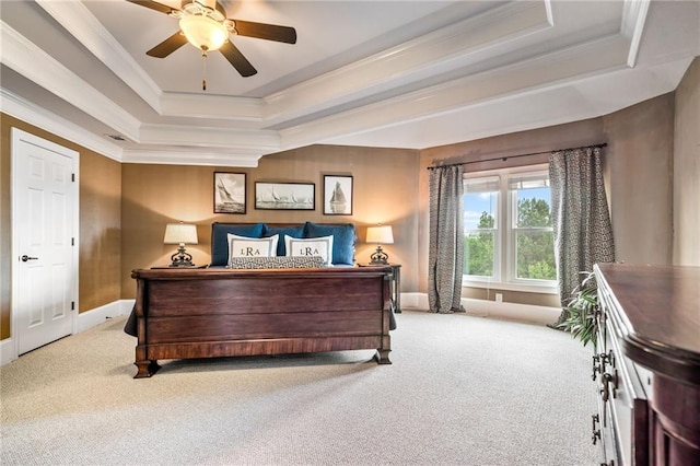 bedroom with a raised ceiling, carpet, baseboards, visible vents, and ornamental molding
