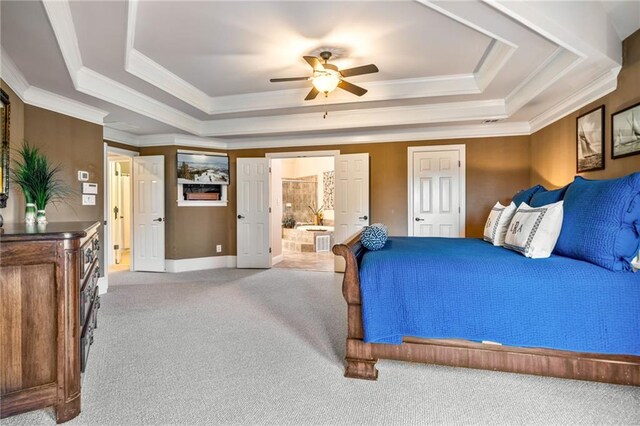bedroom with a raised ceiling, carpet, baseboards, visible vents, and ornamental molding