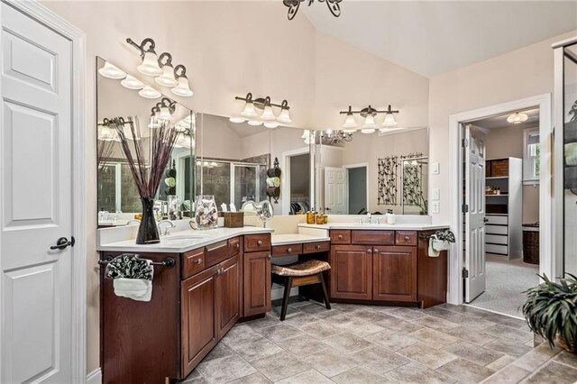 carpeted bedroom with crown molding, connected bathroom, and a raised ceiling