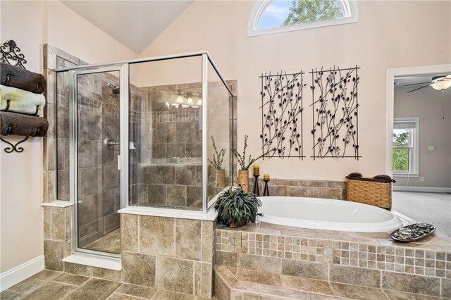 full bath with a bath, a stall shower, vanity, baseboards, and a notable chandelier