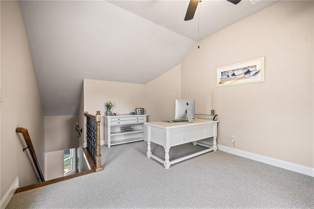 bathroom with ceiling fan, a garden tub, vaulted ceiling, a stall shower, and baseboards