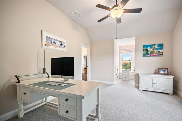 walk in closet with visible vents, carpet flooring, and lofted ceiling