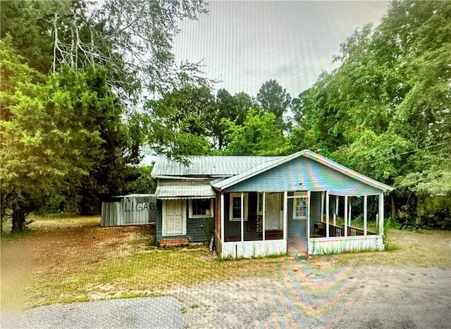 view of front of property with a sunroom