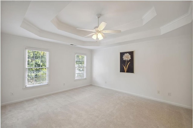2350 Twelvestones Dr, Roswell, GA 30076 - empty room featuring a tray ceiling, ceiling fan, light carpet, baseboards, and ornamental molding
