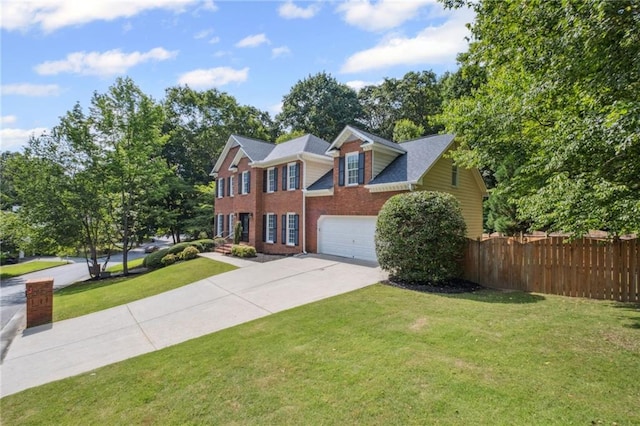 2350 Twelvestones Dr, Roswell, GA 30076 - colonial-style house with concrete driveway, brick siding, and an attached garage