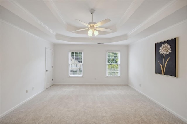 2350 Twelvestones Dr, Roswell, GA 30076 - spare room featuring a tray ceiling, crown molding, light colored carpet, and ceiling fan