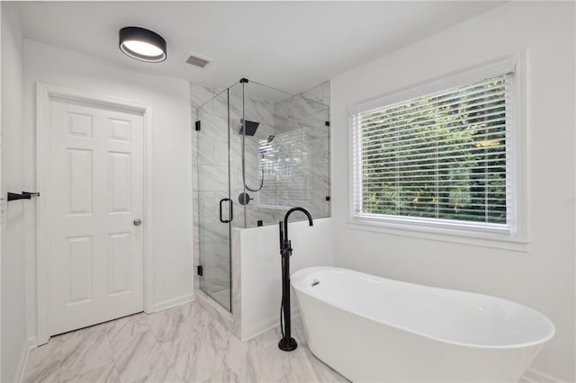 2350 Twelvestones Dr, Roswell, GA 30076 - full bath with marble look tile flooring, a soaking tub, a stall shower, and baseboards