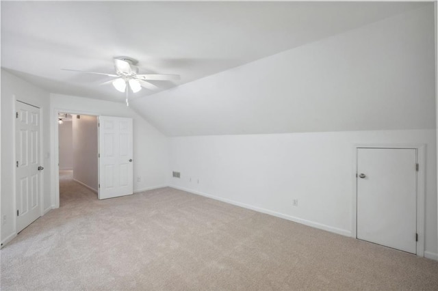 2350 Twelvestones Dr, Roswell, GA 30076 - additional living space with ceiling fan, light carpet, lofted ceiling, and baseboards