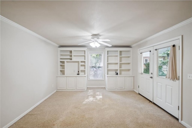 2350 Twelvestones Dr, Roswell, GA 30076 - unfurnished living room with healthy amount of natural light, crown molding, baseboards, ceiling fan, and light carpet