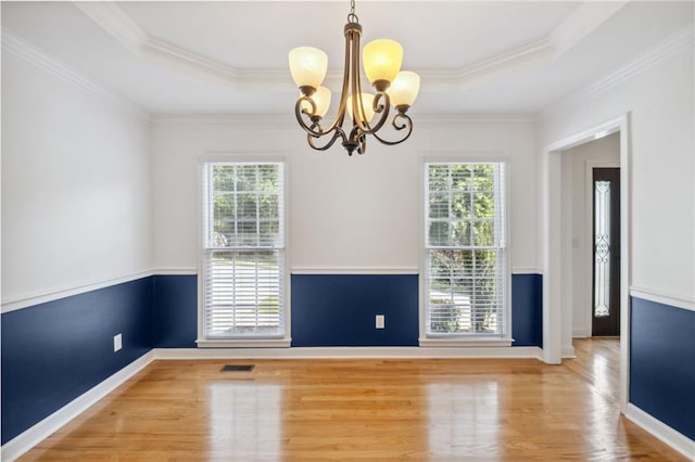 2350 Twelvestones Dr, Roswell, GA 30076 - unfurnished room featuring plenty of natural light, a chandelier, wood finished floors, a raised ceiling, and crown molding