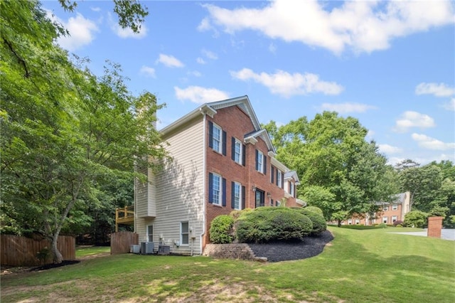 2350 Twelvestones Dr, Roswell, GA 30076 - view of side of home featuring a lawn and central AC