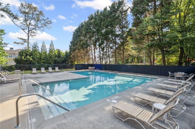 2350 Twelvestones Dr, Roswell, GA 30076 - community pool with a patio area and view of scattered trees