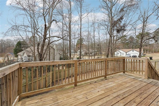 wooden terrace with a residential view