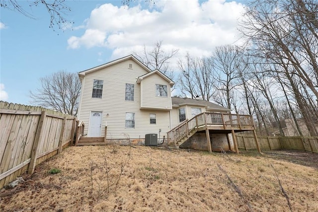 back of property with stairway, central AC, a fenced backyard, and a deck