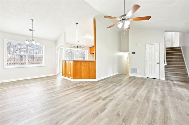 unfurnished living room featuring stairway, baseboards, visible vents, and light wood finished floors