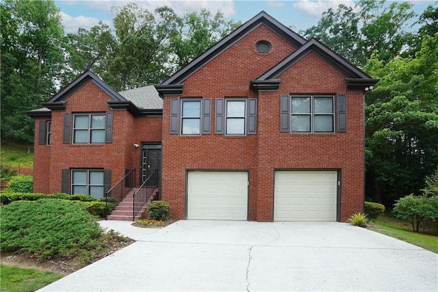 655 Golden Meadows Ln, Suwanee, GA 30024 - view of front facade with a garage, driveway, and brick siding