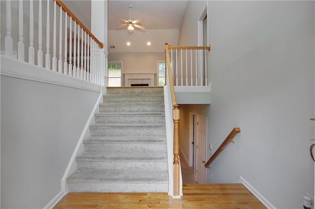 655 Golden Meadows Ln, Suwanee, GA 30024 - stairway with a ceiling fan and wood finished floors