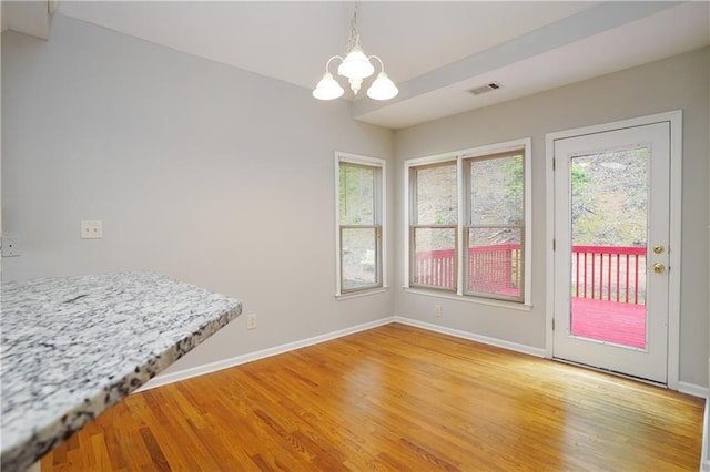 655 Golden Meadows Ln, Suwanee, GA 30024 - dining area with a chandelier and light wood-style floors