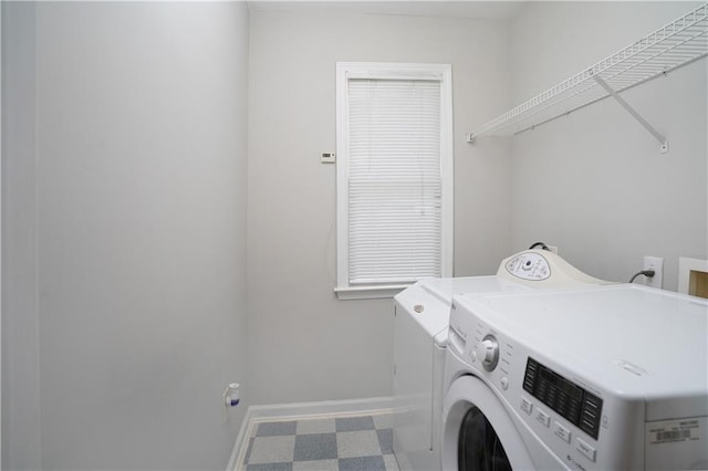 655 Golden Meadows Ln, Suwanee, GA 30024 - laundry room with washer and clothes dryer and tile patterned floors