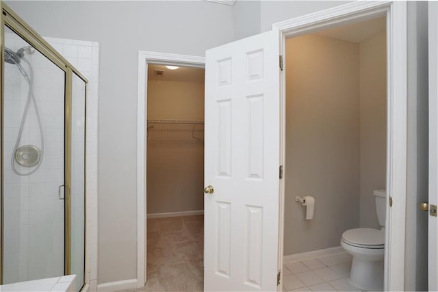655 Golden Meadows Ln, Suwanee, GA 30024 - bathroom featuring a shower stall and a spacious closet