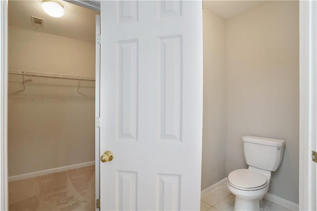 655 Golden Meadows Ln, Suwanee, GA 30024 - bathroom with toilet and a walk in closet