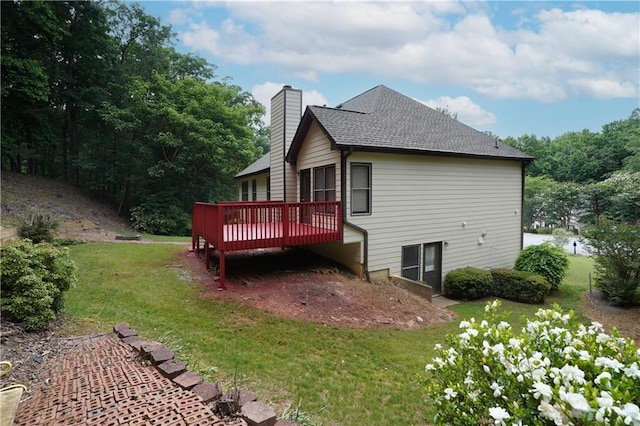 655 Golden Meadows Ln, Suwanee, GA 30024 - back of house with a wooden deck, a lawn, a chimney, and a shingled roof