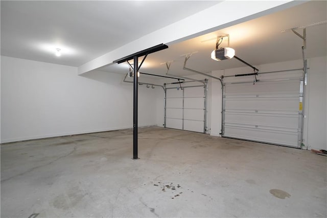 655 Golden Meadows Ln, Suwanee, GA 30024 - garage featuring a garage door opener