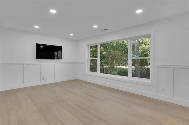 unfurnished room with light hardwood / wood-style flooring