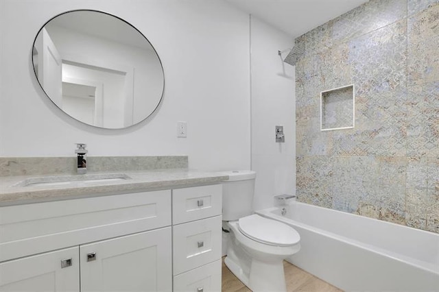 full bathroom with toilet, vanity, and bathing tub / shower combination