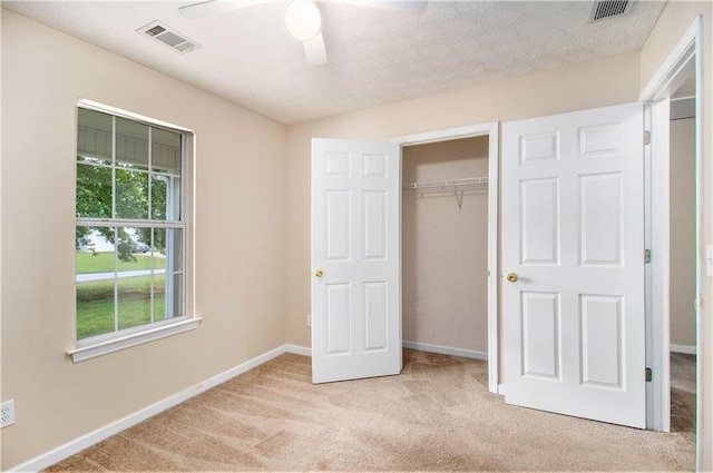 60 Cypress Dr, Covington, GA 30016 - unfurnished bedroom featuring carpet, a closet, and a ceiling fan
