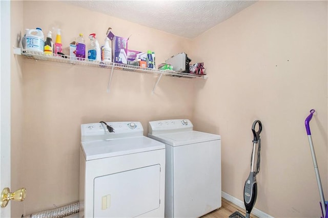 60 Cypress Dr, Covington, GA 30016 - washroom with washing machine and dryer and a textured ceiling
