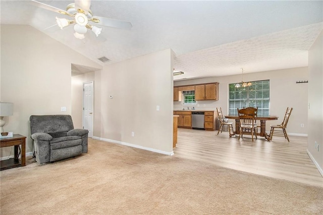 60 Cypress Dr, Covington, GA 30016 - sitting room with light carpet, lofted ceiling, ceiling fan, and light wood-style flooring