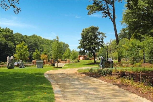 view of property's community featuring a yard