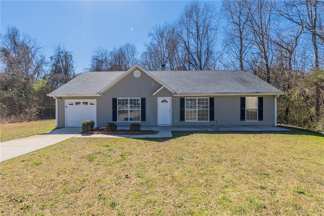 single story home featuring a garage, driveway, and a front lawn