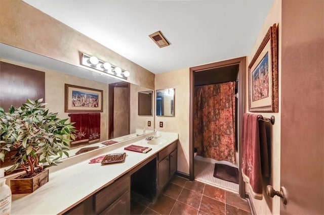 bathroom featuring vanity and a shower with shower curtain