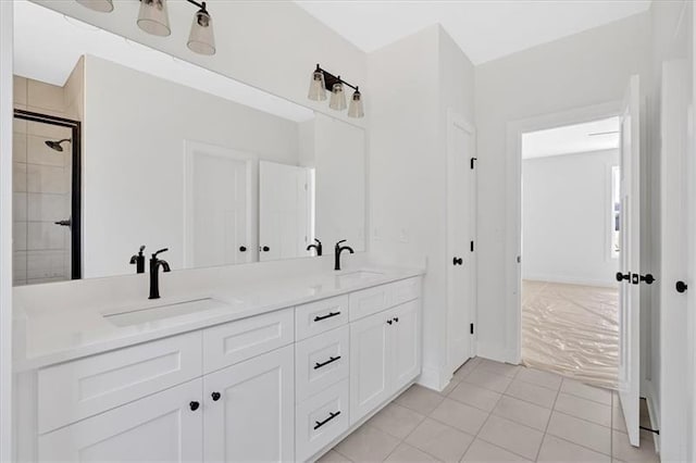 81 Bridgemill Dr, Douglasville, GA 30134 - full bath featuring double vanity, a tile shower, and tile patterned flooring