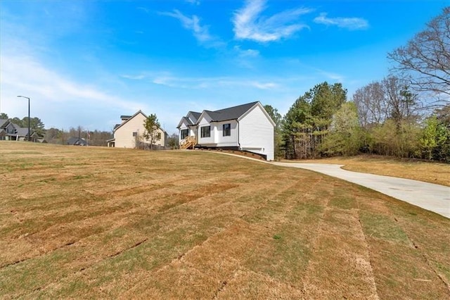 81 Bridgemill Dr, Douglasville, GA 30134 - view of home's exterior with a lawn